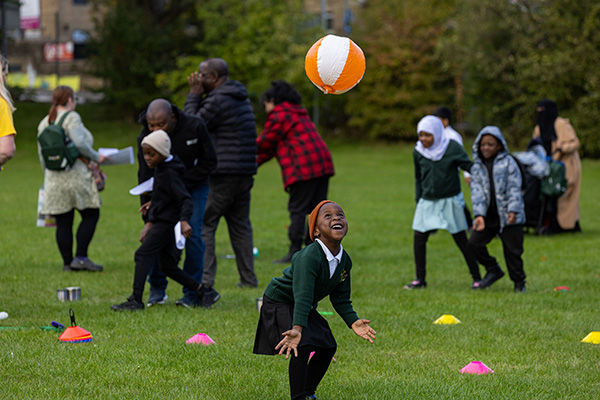 A girl about to catch a beachball